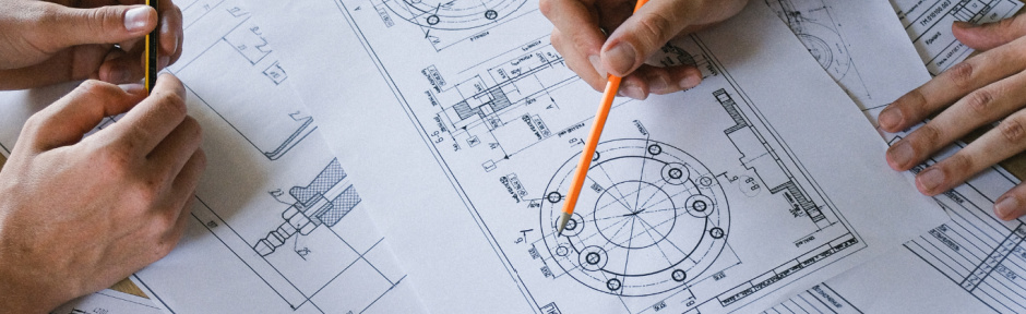 Group of engineers looking at drawings