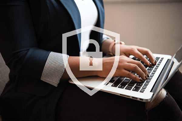 Cybersecurity professional working on a computer