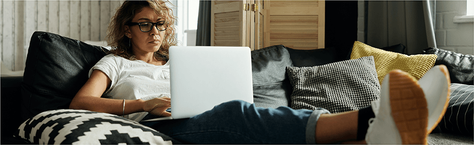 Woman taking an online class from her living room