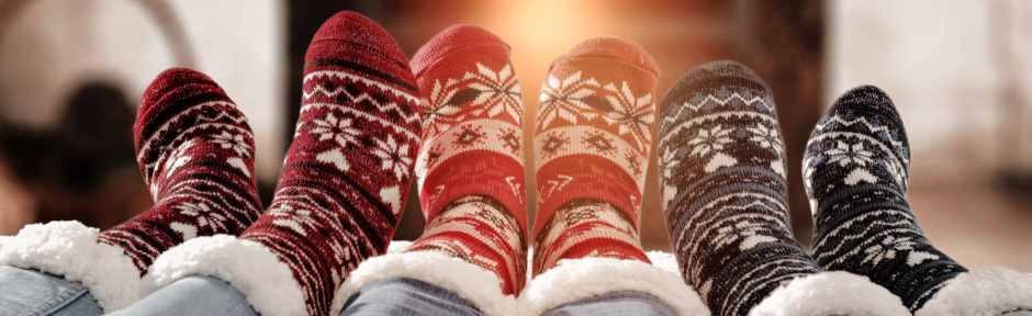 Family with their feet up in front of the fire