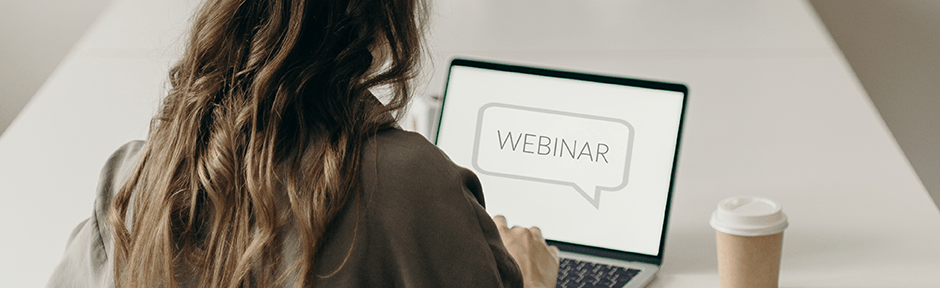 Woman watching a webinar on her laptop