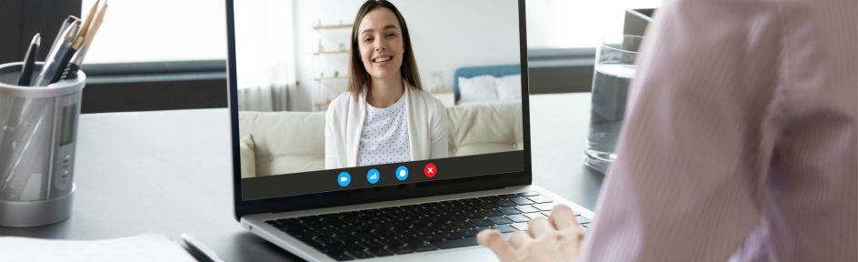 Woman watching a webinar on her laptop