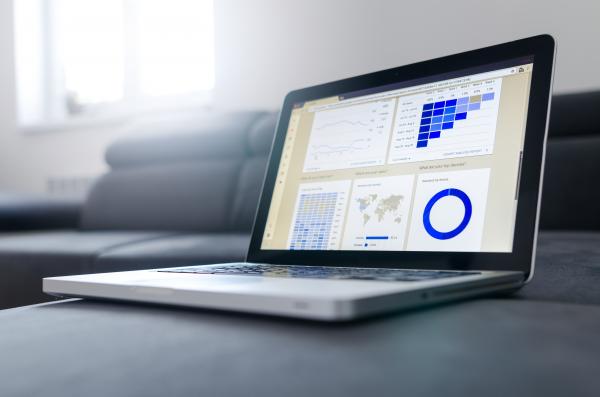 Laptop showing charts and graphs on-screen