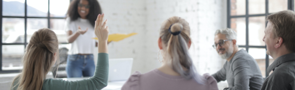 Woman asking a question in a team meeting