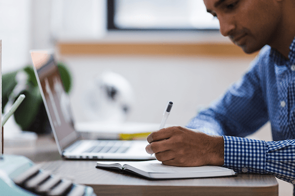 Man working on a grant proposal at his desk