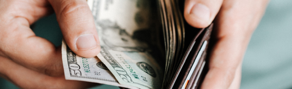 Man counting money in his wallet