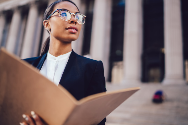 Paralegal standing in front of a courthouse