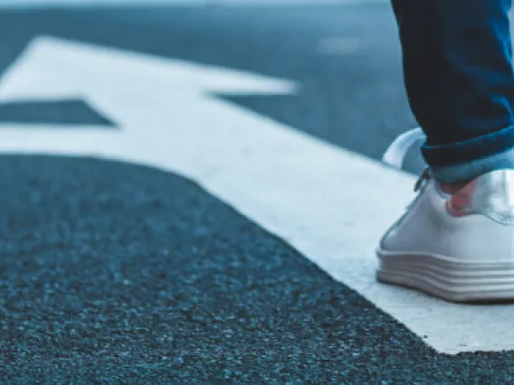 Person walking on street and choosing which direction to turn