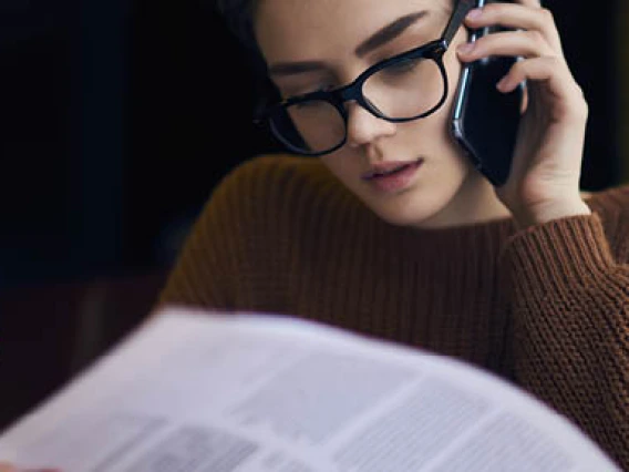 Cannabis Compliance Manager reviewing documents