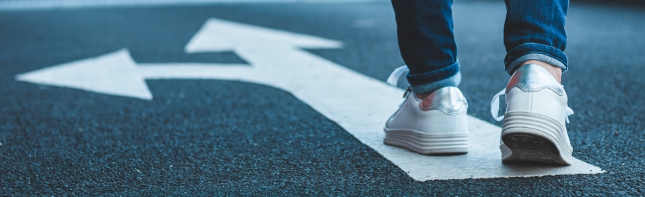 Person walking on street and choosing which direction to turn