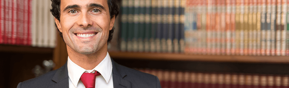 Smiling paralegal in a law library