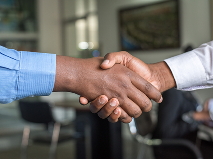 two men shaking hands