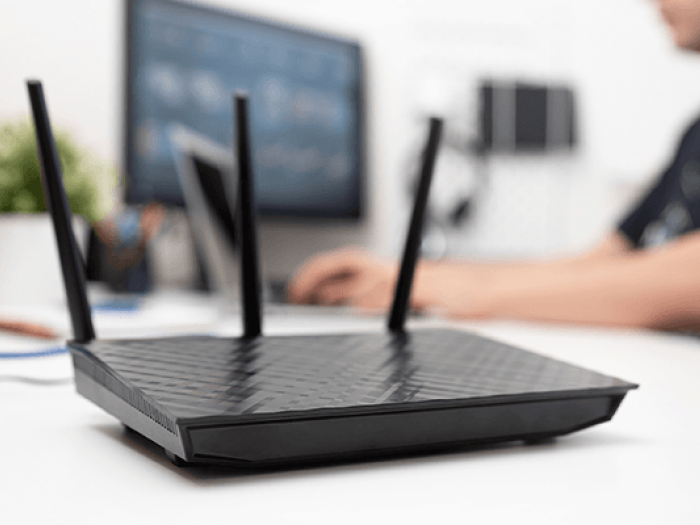 Man working on wireless network equipment