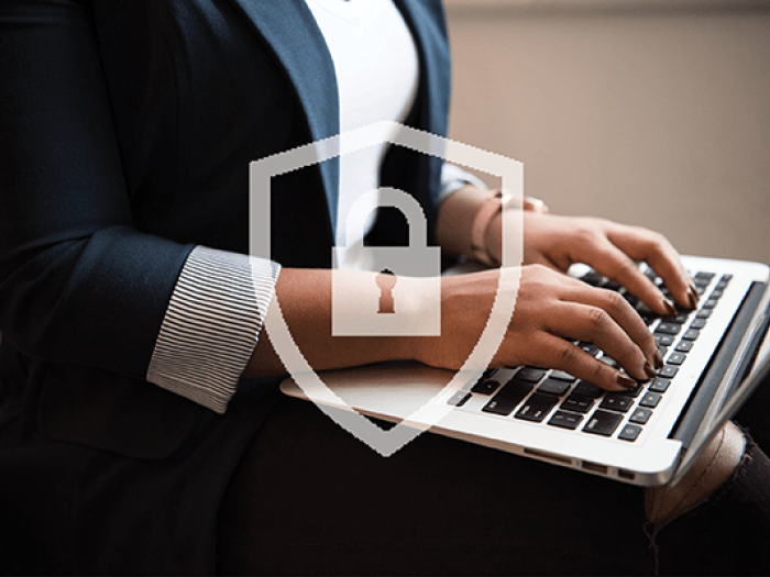 Cybersecurity professional working on a computer