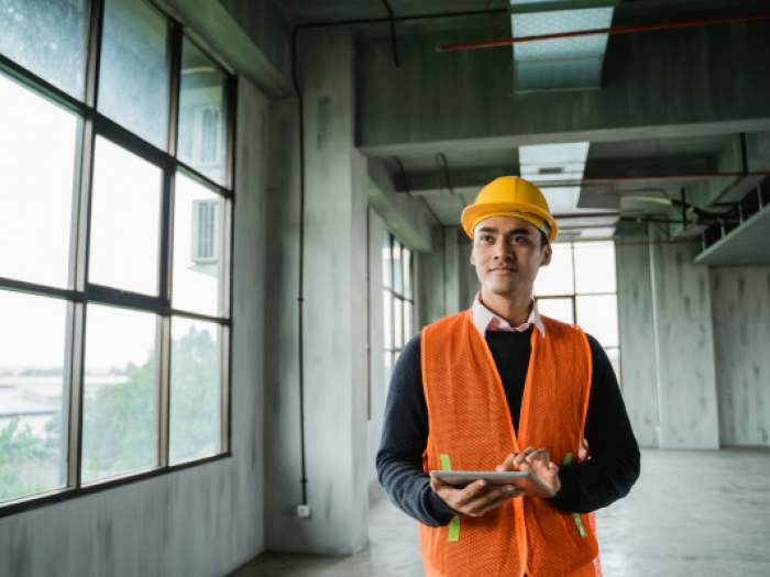 Fundamentals of Engineering Exam Prep Licensed professional engineer inspecting a building site