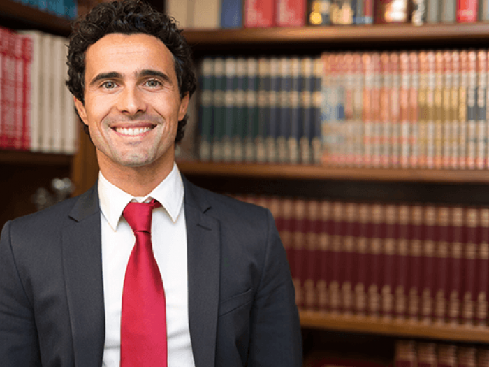 Smiling paralegal in a law library