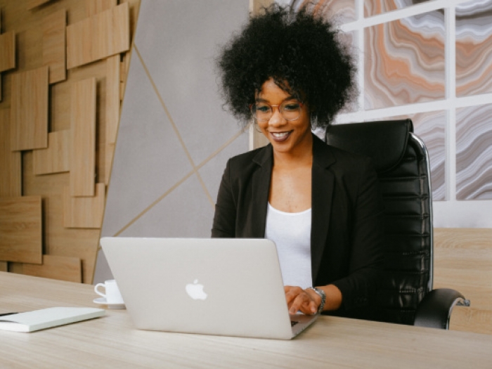 Woman watching a seminar on her laptop
