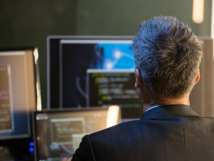 IT manager working in his office